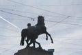 Monument to a horse and rider in the crosshairs of wires. Royalty Free Stock Photo