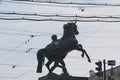 Monument to a horse and rider in the crosshairs of wires. Royalty Free Stock Photo