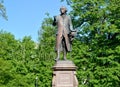 Monument to Immanuel Kant against the background of young foliage. Kaliningrad Royalty Free Stock Photo