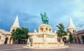 Monument to King Matthias against the background of the towers of the Fisherman`s Bastion in Budapest Royalty Free Stock Photo