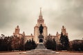 Monument to Mikhail Vasilyevich Lomonosov in front of Moscow State University main building. Dramatic cloudy sky