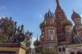 The Monument to Minin and Pozharsky in front of Saint Basil`s Cathedral at Red Square in Moscow, Russia.