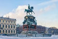 The monument to Nicholas I at the Isaac square in the snow falling.