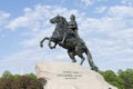 Monument to Peter 1, the bronze horseman in the background the spire of the Admiralty