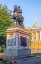 Monument to Peter the Great near the Mikhailovsky Castle in St. Petersburg. On the pedestal there is an inscription in Russian Royalty Free Stock Photo