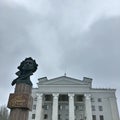 Monument to Pushkin. Donetsk Drama Theater. Cloudy gray sky.