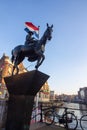 Monument to Queen Wilhelmina on horse in Amsterdam at sunset in winter