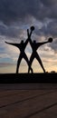 Monument to the sailor silhouette against sunset sky, Taranto, Italy