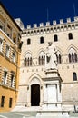 Monument to Sallustio Bandini and Palazzo Salimbeni in Siena, Italy Royalty Free Stock Photo