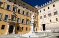 Monument to Sallustio Bandini and Palazzo Salimbeni in Siena, Italy