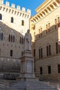 Monument to Sallustio Bandini and Palazzo Spannocchi, Gothic style urban palace in Piazza Salimbeni, Sienna, Tuscany region Royalty Free Stock Photo