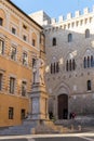 Monument to Sallustio Bandini and Palazzo Spannocchi, Gothic style urban palace in Piazza Salimbeni, Sienna, Tuscany region