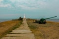 monument to soviet soldiers killed in the second world war and artillery cannon. mourning wreaths at the foot of the