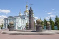 Monument to St. Pitirim Bishop of Tambov against the background of the ancient Transfiguration Cathedral