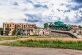 Monument to the tank against the background of buildings bombed by the russians Royalty Free Stock Photo