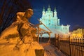 The monument to Taras Shevchenko in the snow and St. Andrew`s Church on a hill at night. Andriyivskyy Descen uzviz. Kyiv