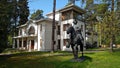 Monument Tsar Peter 1 sitting on a horse made of bronze in the courtyard of a house in the Latvian city of Jurmala on