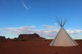 Monument valley landscape with tipi and blue sky Royalty Free Stock Photo