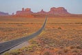 Before dawn, a long road leads to the icons of Monument Valley. Royalty Free Stock Photo