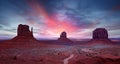 Monument Valley under a scenic sunset sky Royalty Free Stock Photo