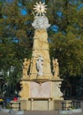 Monument with various decorated statuettes in central square of Subotica, Serbia