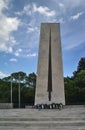 Monument of World War II with wreaths in Komotini, East Macedonia, Greece. Impressive tall stone tower with a sword