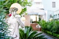 Monument of young man in the hotel territory. Sculpture of man. Outdoor marble statue in summer garden.