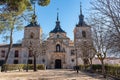 Monumental complex of church and palace next to a wooded public park in the city of Nuevo Baztan, Madrid.