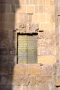 Monumental door detail gold in the historic of Cordoba Spain