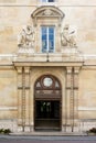 Monumental entrance gate to the historic building of the Ecole Normale SupÃ©rieure (ENS), Paris, France