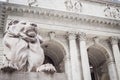 Monumental entry of The New York Public Library with the statue of the lion truncating and watching passersby