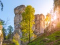 Monumental sandstone rock formation in the miidle of spring forest of Bohemian Paradise, Czech: Cesky raj, Czech