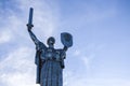 Monumental statue The Motherland Monument against cloudy blue sky Kyiv, Ukraine