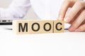 MOOC - Massive Open Online Course - acronym on wooden cubes on a white background