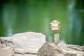 Mood lighting light fixture on rocks the water Royalty Free Stock Photo