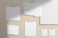 Moodboard template composition with blank photo cards, torn paper, square frames glued with adhesive tape on light coffee color Royalty Free Stock Photo