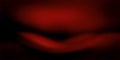 Moody abstract gradient background featuring deep red and black hues Royalty Free Stock Photo