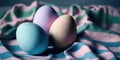 A moody, atmospheric still life featuring pastel-colored Easter eggs on a fabric background