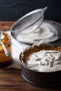 Moody Banoffee pie closeup with caramel on the wooden table