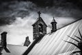 Moody Church bell and cross on roof with storm clouds, moody image Royalty Free Stock Photo