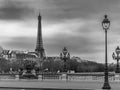 Moody cityscape with Pont Alexandre III bridge, Seine river and Eiffel Tower in Paris, France in black and white Royalty Free Stock Photo