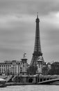 Moody cityscape with Pont Alexandre III bridge, Seine river and Eiffel Tower in Paris, France in black and white Royalty Free Stock Photo