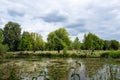 Moody cloudy sky, gorgeous large trees, a view of the lake. Finsbury Park