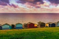 Moody cloudy weather creating patches of sunlight between the clouds on the sea in Tankerton, Whitstable in Kent. Royalty Free Stock Photo