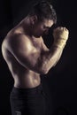 Moody dark portrait of bodybuilder