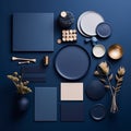 Moody And Evocative: Blue, White, And Gold Plates And Decors On A Minimalist Navy Background Royalty Free Stock Photo