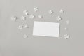 Moody feminine wedding, birthday mockup scene. Closeup of blank paper business card, invitation on grey table background