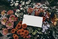 Moody feminine wedding, birthday mockup scene. Closeup of blank paper card, gift tag label on colorful floral bouquet in