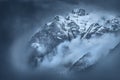 Moody foggy scene on mountain peaks in Tyrol