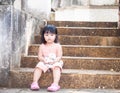 Moody girl sitting alone in the temple